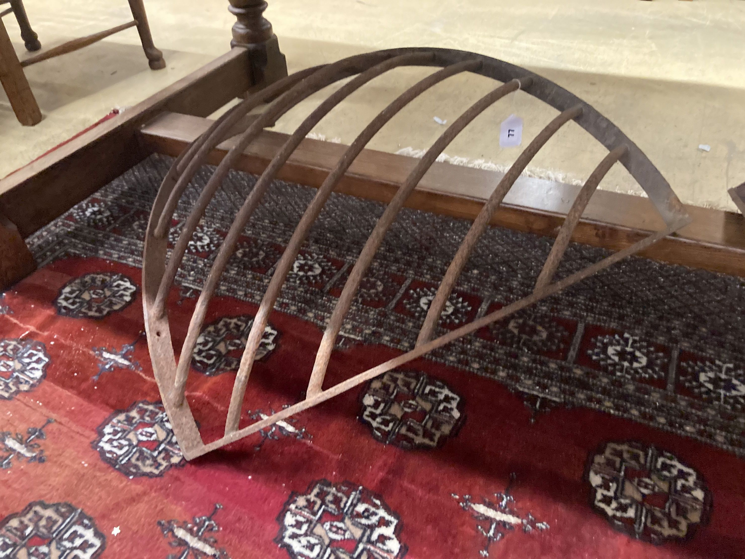 A pair of wrought iron corner stable mangers, each 80cm wide, height 76cm